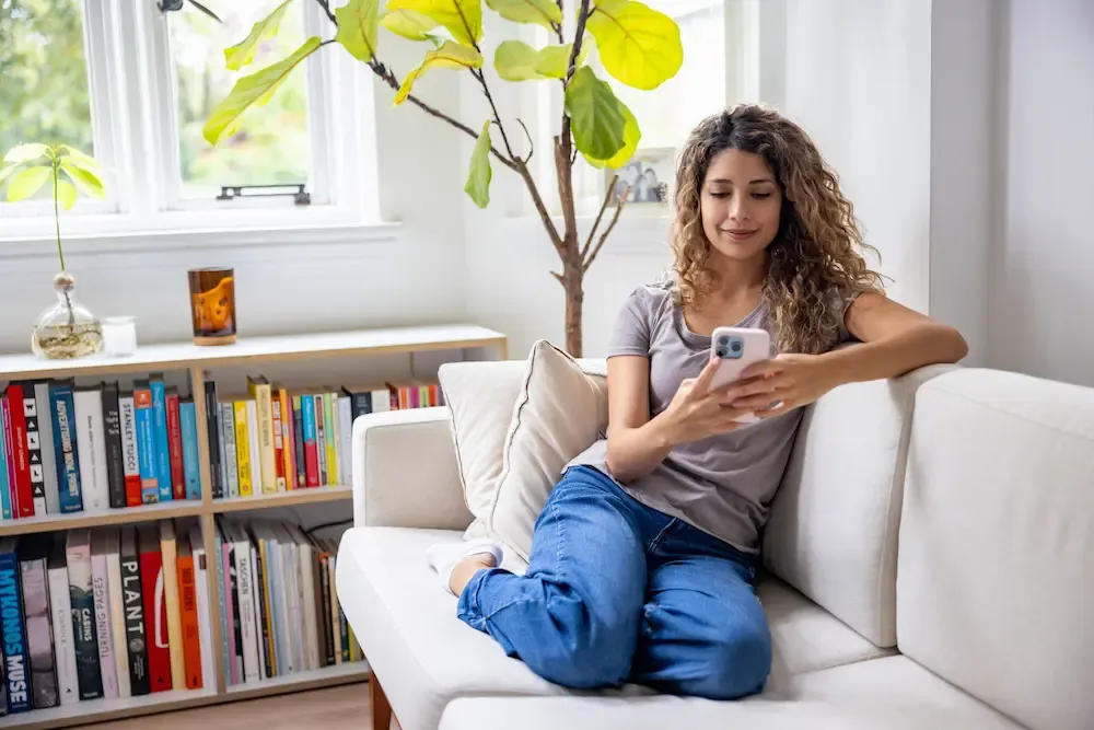latino woman using cell phone